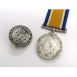 A WWI Silver War Badge numbered 424208 (25306 PTE. ALFRED PALMER- enlisted 04.12.15, discharged 03.