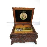 A Symphonion Rococo disc musical box in an ornately moulded 18th Century style case,