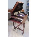 A Piano Operaphone in a piano-shaped case with Glen Miller records