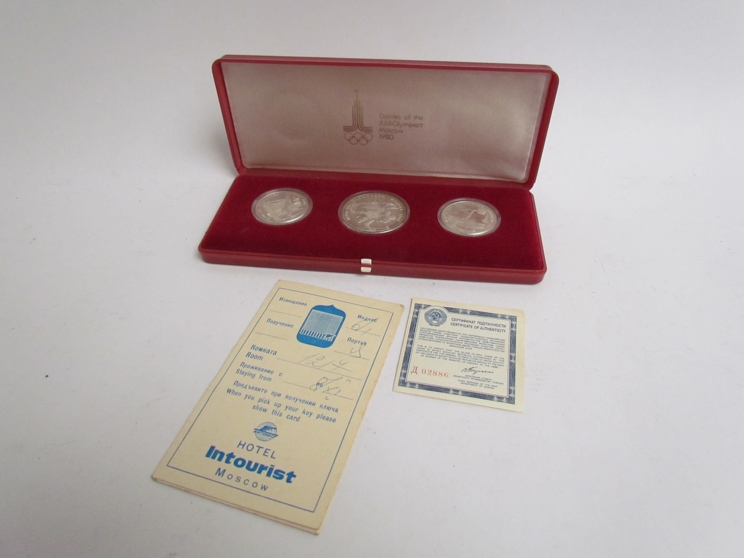 A cased set of three Russian Olympic tokens from the 1980 Mosco Olympiad (3)