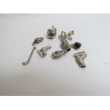 A quantity of white metal bracelet charms including boxing gloves,