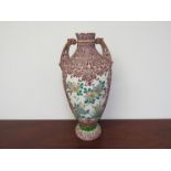 An early to mid 20th Century Oriental vase with hand applied slip decoration,