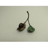 A cold painted bronze study of conker with leaf 144/150,