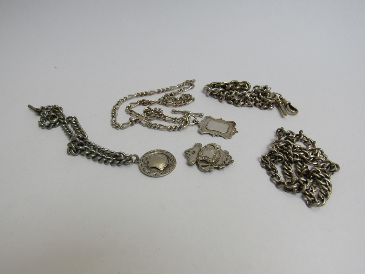 Three silver watch chains, three silver alberts and a plated watch chain,