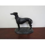 A cast bronze figure of standing greyhound,