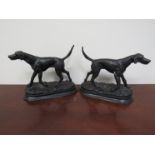 A pair of cast bronze figures of pointers,