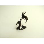 A miniature pair of bronze Boxing Hares,