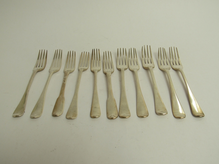 Eleven silver Georgian & Victorian forks, some with crested handles, London 1808, 1865, 1804, 1826,