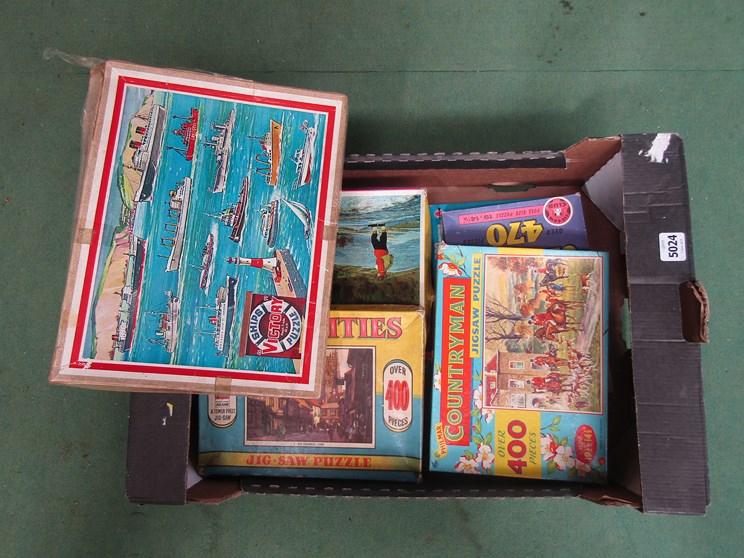 A box of vintage jigsaws