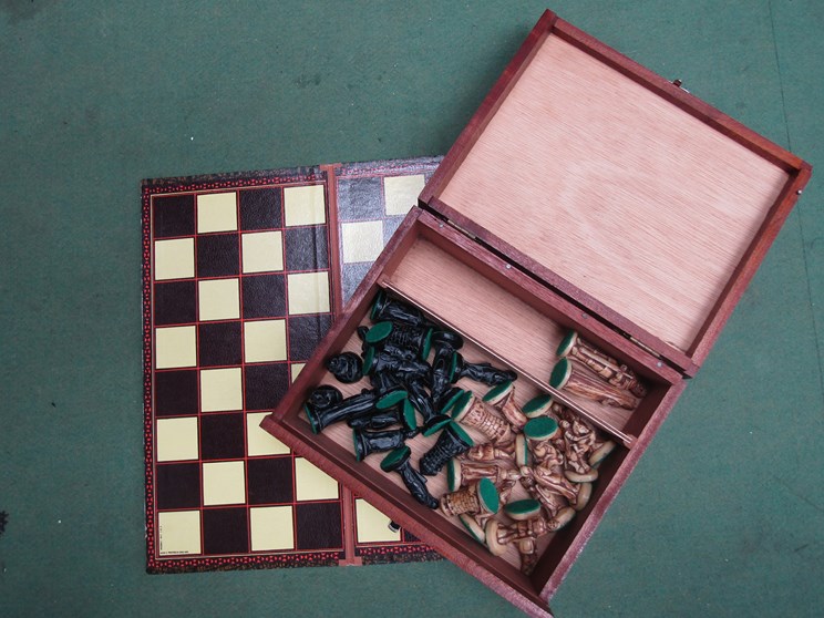 A resin chess set (incomplete) and chess board