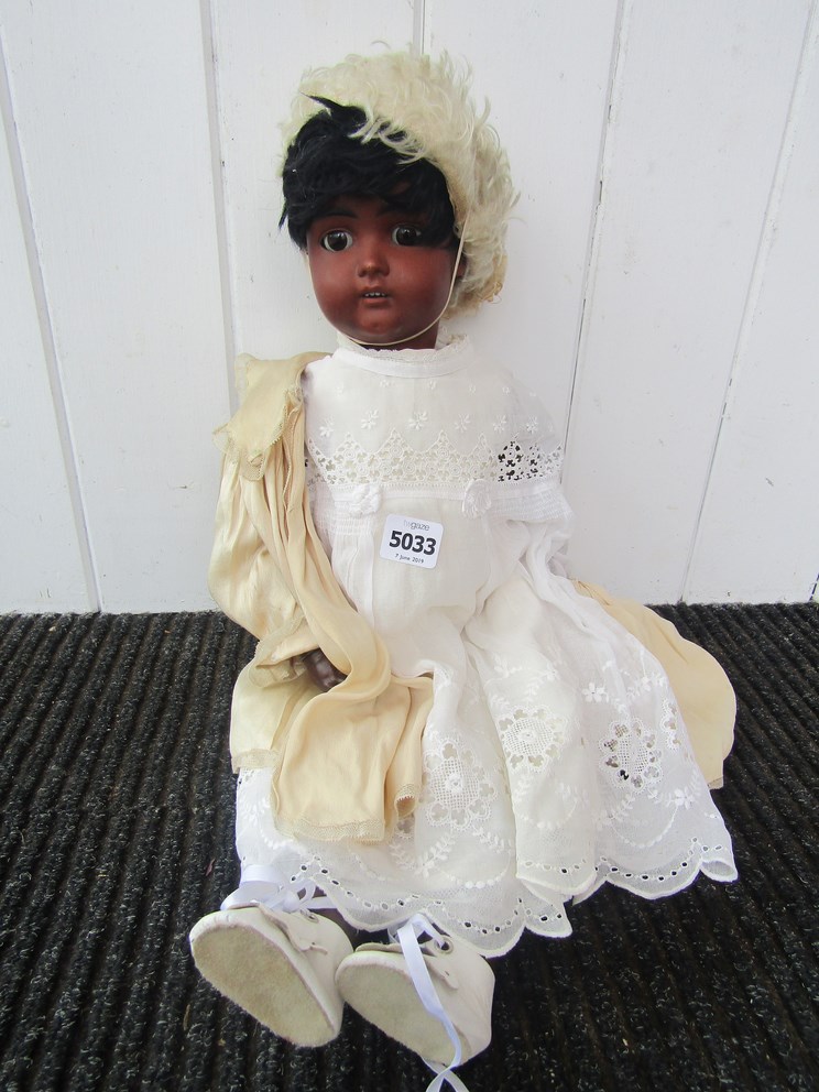 A Catterfelder Puppenfabric no:3 black bisque girl doll on jointed coposition body.