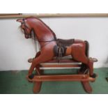 A House of Marbles carved wooden rocking horse on trestle rocker