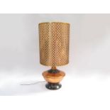 A 1970's copper table lamp with lattice form cylindrical shade, squat form made by Copper Craft,