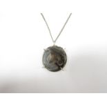 A 1970's white metal and natural Geode stone pendant on white metal chain