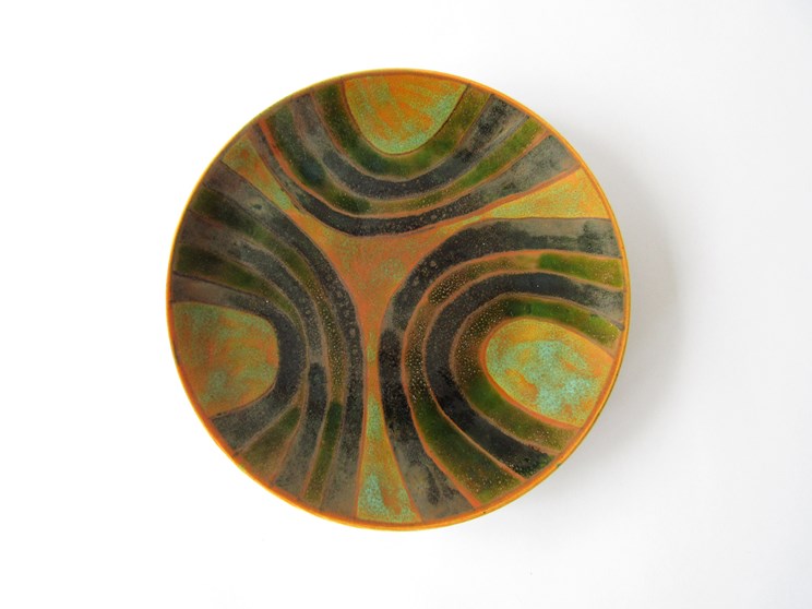 A Poole Studio plate, c1964-66 in green, black and ochre colours. Blue back stamp. 20.