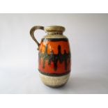 A West German Scheurich Fat Lava single handled vase in orange, treacle, white and brown glazes,