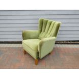 A 1940's Danish armchair, green velor upholstery,