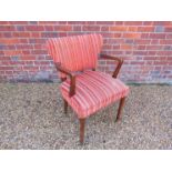A 1940's dark stained beech armchair,