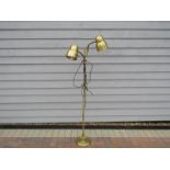 A Danish brassed standard lamp with twin adjustable spots