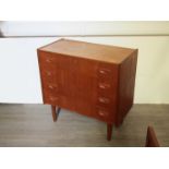 A Danish teak chest of four drawers, raised on tapering legs, 79.5cm x 40cm x 78.