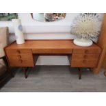 A Meredew teak twin pedestal dressing table with seven drawers. 155.