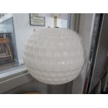 A spherical white textured plastic ceiling lamp