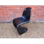 A Verner Panton style black fiberglass chair