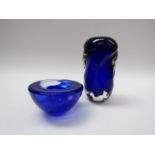 A small Kosta Boda bowl in blue glass and a blue molten form blue vase encased in clear, unmarked,