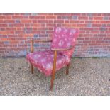 A 1940's dark stained beech armchair,