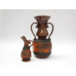 An Italian Giovanardi Tarcisio ceramic twin handled vase in orange lava and brown glaze with relief