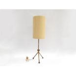 A 1950's brass table lamp base, metal rod and ball on tripod base, black wooden ball feet.