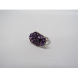 A sterling white metal palette ring multi set with amethysts