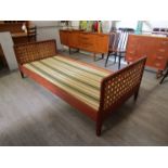 A Danish teak single bed frame with woven ply slatted ends