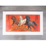 A period hessian framed print illustrating three charging horses on an orange and red mottled