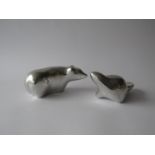 A pair of modernist aluminium figures of a Polar Bear and Beaver by Hosleton Sculpture of Canada.