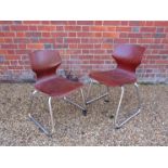 Two Pagholz chairs with curved tubular chromed metal supports