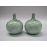 A pair of porcelain vases with pale green crystalline glaze, unmarked,