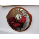 A teak mounted circular wall mirror. 44.