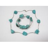 A large turquoise matrix stone necklace and matching bangle