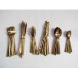 A quantity of bronze cutlery in the manner of Scanline MCM,
