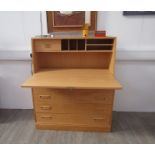 A Danish light oak bureau with four drawers below, fitted interior,