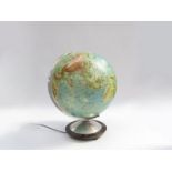 A glass world globe lamp made in West Germany by Columbus Erdglobus