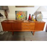 A teak sideboard by Jentique dated Nov 1967 on drawer, 198cm x 45cm x 74.