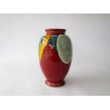 A Poole pottery 'Living Glaze' range vase, red ground with blue, turquoise and yellow.