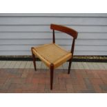 A Danish teak dining chair with woven papercord seat,