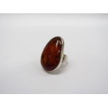 A mid 20th Century large natural amber stone ring in sterling silver,