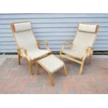 A pair of bent ply framed lounge chairs with a single matching stool,