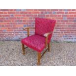 A 1940's dark stained beech armchair,