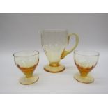 A Whitefriars amber water jug and two glasses,