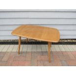 An Ercol light elm coffee table,